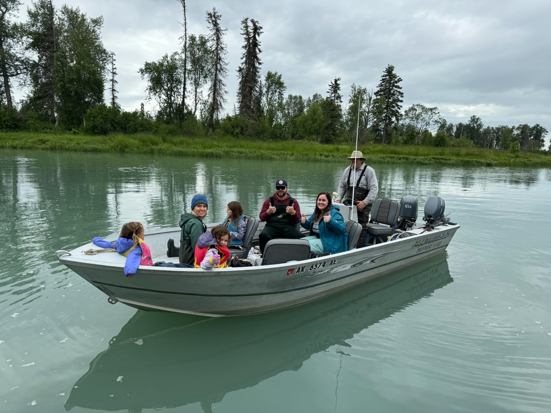 Family aboard a jet boat on the Kenai River